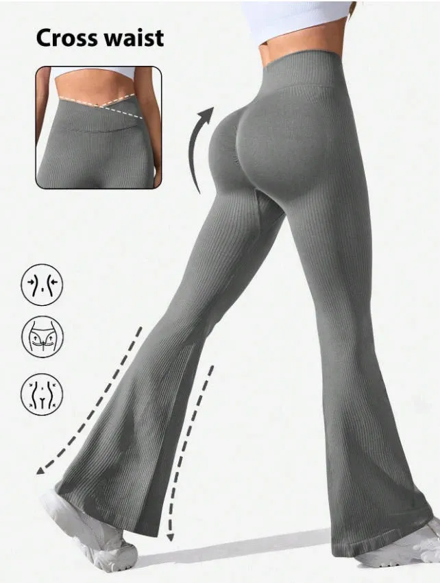 A model showcasing high-waisted flared leggings in a grey color, emphasizing the flattering silhouette and comfort. The leggings feature a cross waist design and are paired with a simple top and sneakers.